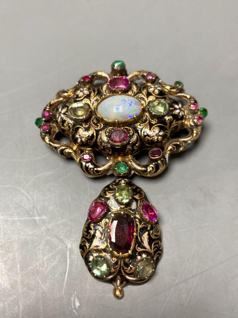 A Victorian yellow metal, enamel and multi gem set suite of jewellery (adapted), comprising a drop pendant brooch and pair of earrings